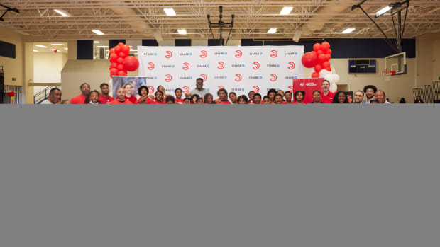 Kids pose at Atlanta Hawks basketball camp.